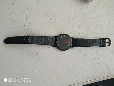 saat şamdan: Часы на кожаном ремешке с дизайном 1/mim ×1000 Германия — 2