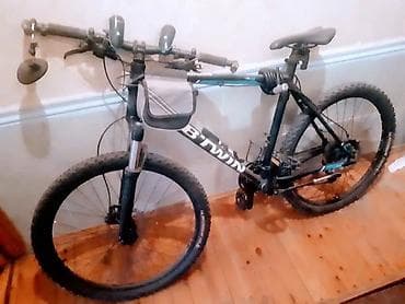 velosiped enli teker: B’TWIN dağ velosipedi Xüsusiyyətlər: - Alüminium gövdə, 26” təkərlər — 2