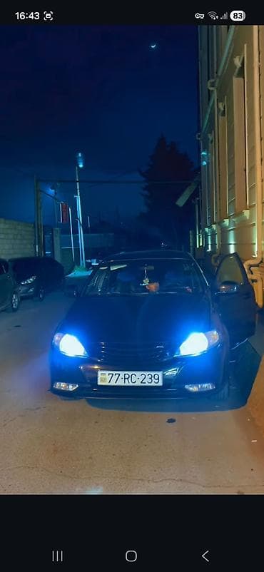 chevrolet gentra 2020: Qara rəngli Daewoo Gentra sedan avtomobili. Avtomobilin ön hissəsində — 3