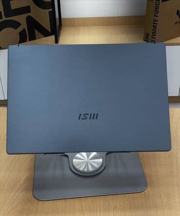 a 11: MSI ultrabook – zərif və yüngül metal gövdə, tünd boz rəng. 14″ nazik — 4