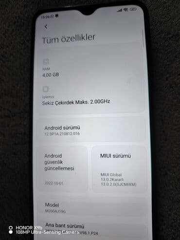 muzukalni centir: Redmi mobil telefonu parlaq firuzəyi rəngdədir və dördlü kamera — 5