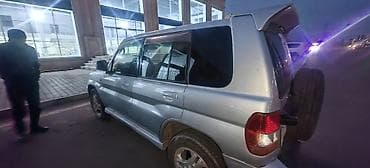 moto debilqe: Mitsubishi Pajero iO (GDI) – kompakt 4x4 krossover/SUV - Gümüşü rəng — 4