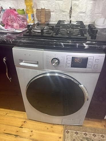 Avto xidmətlər: Avtomat paltaryuyan maşın – ön yükləməli, gümüşü korpus, iri qapılı — 1