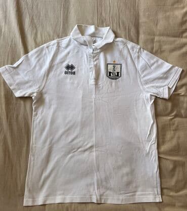 the ordinary mehsullari: Errea tərəfindən istehsal olunan bu ağ rəngli polo köynək idman — 1