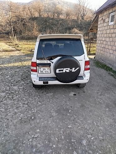 vossen diskleri: Mitsubishi Pajero iO GDI, ağ rəngdə kompakt off-road SUV — 5