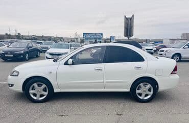 nissan sunny 2010: Nissan Sunny sedan – ağ rəng, 4 qapı, ön çəkiş. Xarici: - Ağ kuzov — 3