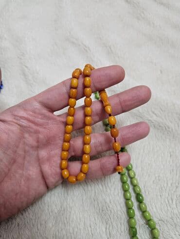 Portmone, pulqabıları: Məhsul: Təsbeh dəsti (3 ədəd) Təsvir: - Üç müxtəlif rəngdə təsbeh — 3
