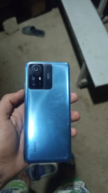 redmi note 10 kontakt home: Arxa tərəfində 108 meqapiksellik kamerası olan mavi rəngli smartfon — 1