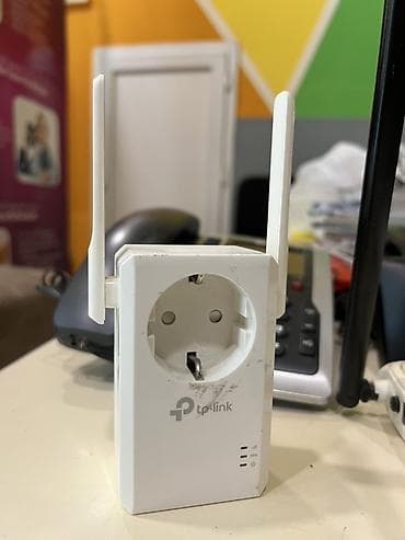 netis router: TP-Link Wi‑Fi siqnal gücləndirici (range extender) – inteqrə edilmiş — 1