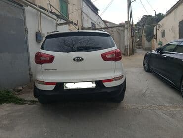 optima kia: Kia Sportage: 2 l | 2011 il Krossover — 2
