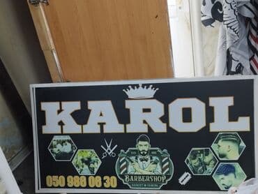 рекламный стенд на улицу: Qara fonda, ağ çərçivəli, "KAROL" sözü iri hərflərlə yazılmış — 1