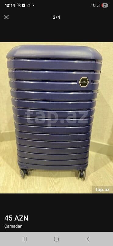 İdman qidaları: Dörd təkərli, tünd göy rəngli səyahət çamadanı. Çamadanın ön — 4