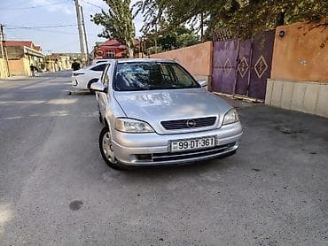 Opel Astra G sedan – gümüşü rəng Texniki xüsusiyyətlər: - Kuzov: 4