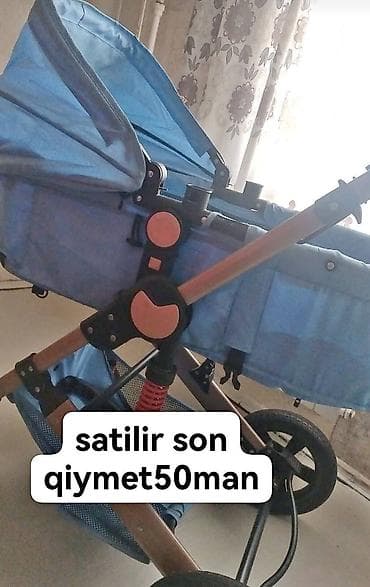 Прогулочные коляски: Uşaq arabası – mavi rəng Xüsusiyyətlər: - Təkhəndli itələmə sistemi — 1
