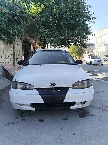 07 stop: Hyundai Accent: 1.5 l | 1995 il Sedan — 1