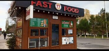 сдам контейнер на ортосайском рынке: Fast food köşk, şüşəli pəncərələri və "FAST FOOD" yazısı ilə görünür — 3