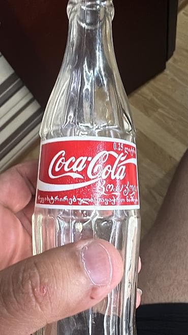 Məhsul: Şüşə Coca‑Cola butulkası Təsvir: - Həcm: 0.25 L (etiketdə lalafo.az -da Məhsul: Şüşə Coca‑Cola butulkası Təsvir: - Həcm: 0.25 L (etiketdə