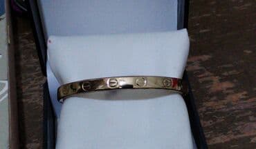 Qızılı rəngdə zərif qolbaq dəsti - Model: 2 ədəd sərt (briqet) qolbaq