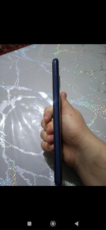 planşetlər və qiymətləri: Xiaomi Redmi (model arxa qapaqda “Redmi” loqosu ilə). Rəng: tünd mavi — 2