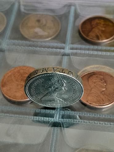 ucuz gitara: Məhsul: Böyük Britaniya 1 funt sikkəsi – 1983 Təsvir: - Nominal: One — 7