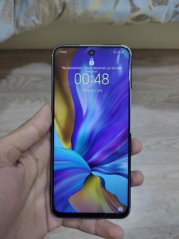 tank telefon qiymeti: Smartfon – böyük tam ekranlı, ön kamerasi ekranın mərkəzində — 2