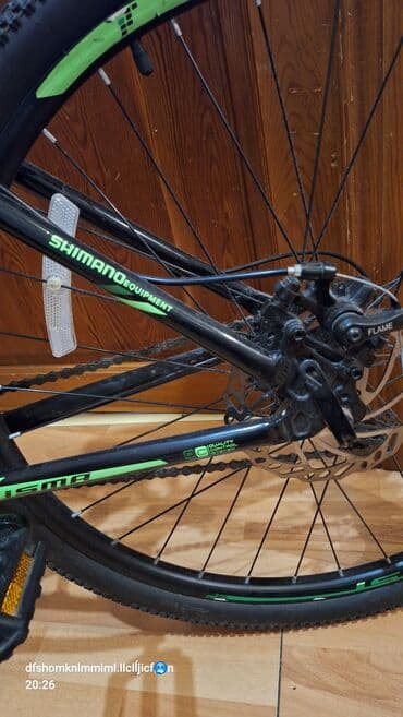 ktm velosipēdi: ISMA markalı, qara rəngli, yaşıl detalları olan dağ velosipedi — 3