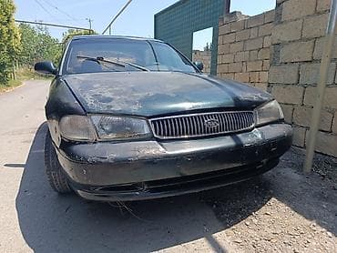 mercedes e 2: Kia Clarus sökülür sedan - Kuzov: 4 qapılı sedan, tünd yaşıl rəng - — 1