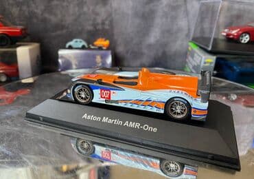 где можно продать марки: Коллекционная модель Aston Martin AMR-One #7 Gulf Team LeMans 2011 — 20