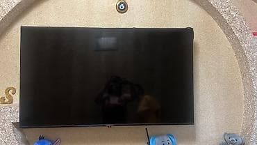 LED televizor – divara quraşdırılmış, nazik korpuslu, qara rəng