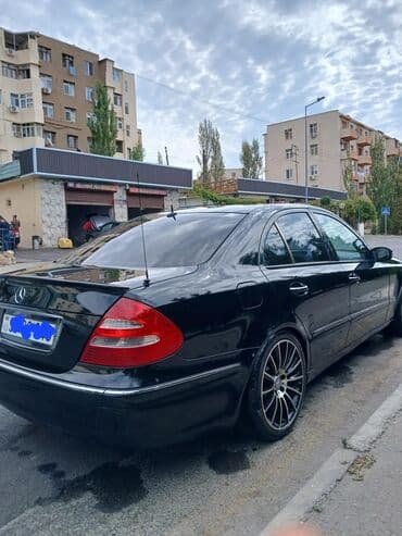 Tavalar: Mercedes-Benz E 320: 3.2 l | 2003 il Sedan — 4