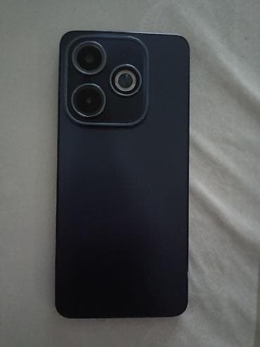 Smartfon – 6,7" təxmini tam ekranlı ön panel, mərkəzdə punch‑hole ön — 1