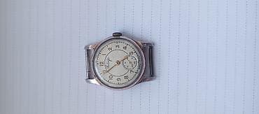 Kişi qol saatı – mexaniki, analoq göstəricili. - Rəng: gümüşü-kmis