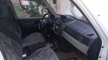 mitsubishi pajero satilir: Mitsubishi Pajero iO, ağ rəngli, 3 qapılı kompakt SUV. Xarici: - Ağ — 7