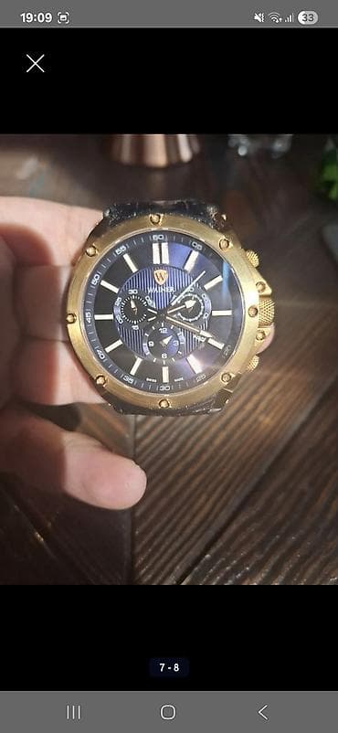 saat kamera: Wainer kişi qol saatı - Korpus: qızılı tonlarda, iri dairəvi bezel — 2