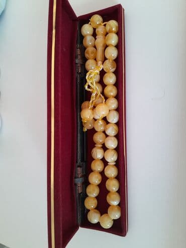 xari bulbul simvolu: Gədimi Kəhrəba təsbeh.Янтарь — 2