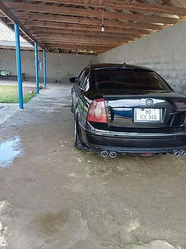 kia optima spoyler: Volkswagen Passat: 1.8 l | 2004 il Sedan — 4