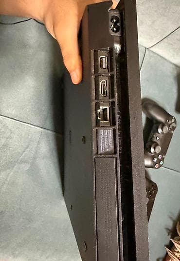PlayStation 4 slim 500 gb.Üzərində 3 disk verilir.Plombu üstündədi — 5