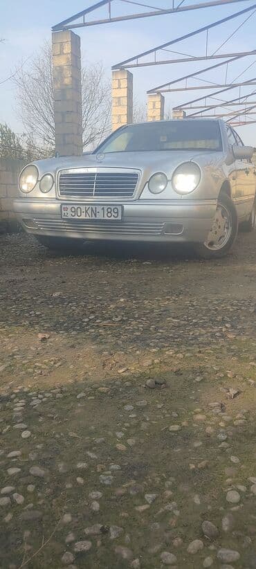traktor şəkilləri: Mercedes-Benz E 230: 2.3 l | 1995 il Sedan — 7