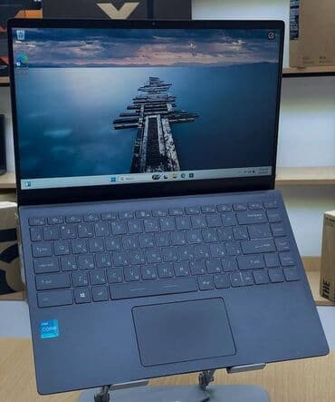 a 11: MSI ultrabook – zərif və yüngül metal gövdə, tünd boz rəng. 14″ nazik — 1