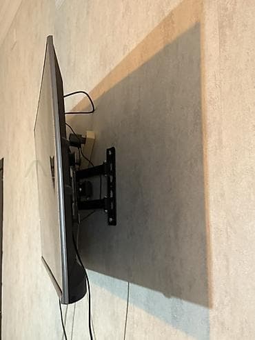 Divar üçün dönər mexanizmlı TV qolu/saqlayıcısı Televizor dönenlrrden