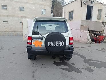 Mitsubishi: Mitsubishi Pajero iO (5 qapı) SUV - Kuzov: ağ/gümüş iki rəngli, yan — 7