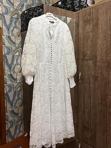 Ağ rəngli, uzunqol, krujeva parçadan hazırlanmış qadın donu. Bu don