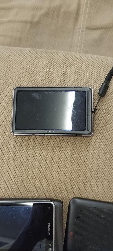 sony mp3 player: Sony Cyber-shot rəqəmsal fotoaparat - Kompakt metal gövdə, sürüşən ön — 1
