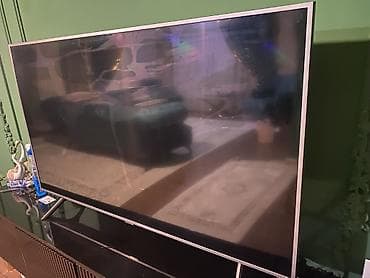 televizor panasonic: Televizor – LED panel, təxminən 55–60 düym ekran ölçüsü, nazik — 1