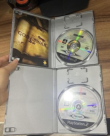 ps4 oyun diskləri: PS2 God of War Original CD İkisi bir yerdə 60 manatdır. Tək-tək — 2
