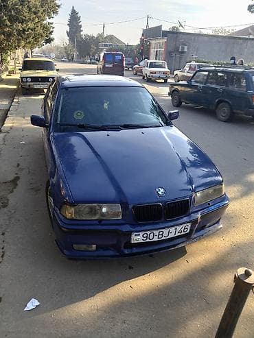 maşın opel: BMW 3 Series E36 sedan – tünd mavi rəng Xüsusiyyətlər: - Kuzov: 4 — 1