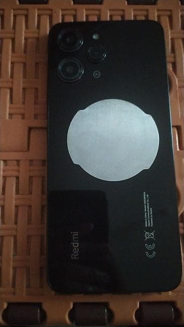 telefon planşet: Məhsul: Redmi 12 Xüsusiyyətlər və dizayn: - Arxa paneldə “Redmi” — 1