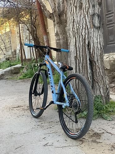 Toba dağ velosipedi - Rəng: açıq mavi, narıncı və qara aksentlər -