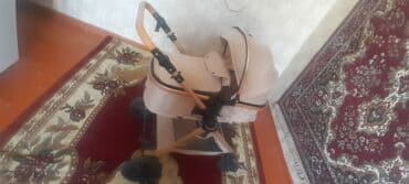 Gəzinti arabaları: Uşaq arabası – bej rəngli, klassik beşik tipli Xüsusiyyətlər: - Geniş — 2