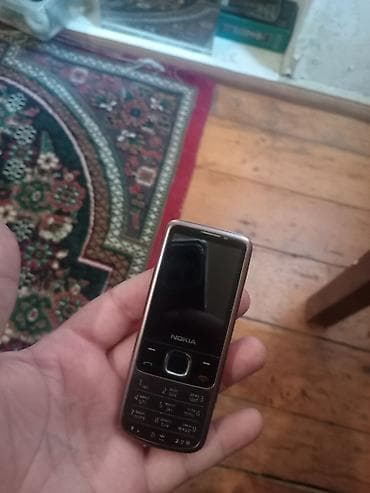 ağdaş telefon: Nokia 2 GB, rəng - Qəhvəyi, Düyməli — 2